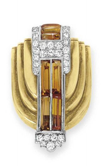 A DIAMOND, CITRINE AND GOLD BROOCH, BY CARTIER   Designed as a sculpted gold shi...