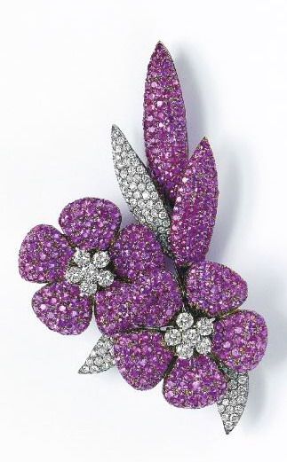 A Pink Sapphire and Diamond Flower Brooch Designed as two articulated pavé-set ...