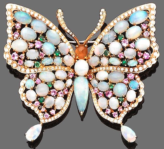 A gem-set butterfly brooch The body and wings set throughout with cabochon opals...