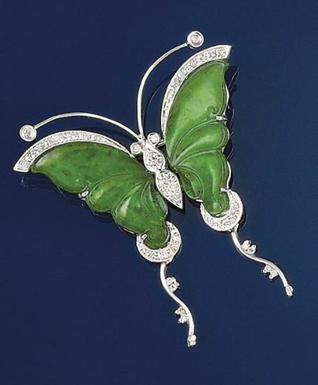 A jadeite and diamond butterfly brooch   Translucent green jadeite wings and dia...