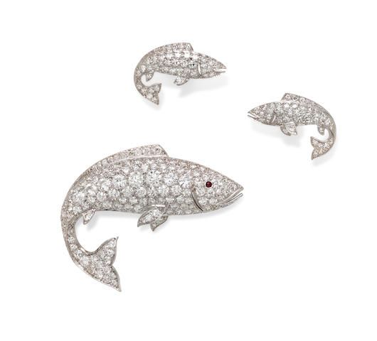 A pair of diamond, ruby and white gold fish earrings and brooch