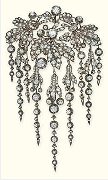 AN ANTIQUE DIAMOND BROOCH   Of en pampille design, the floral spray with pavé-s...