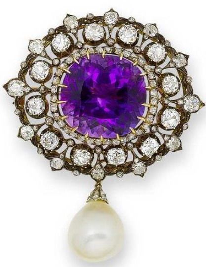 An amethyst, diamond and cultured pearl brooch The large cushion-shaped amethyst...