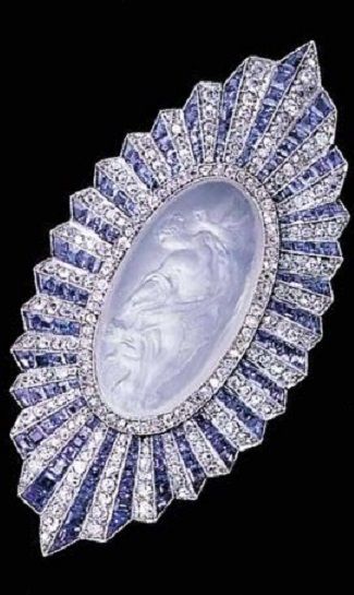 Carved Moonstone, sapphire and diamond brooch, Paul Brandt, circa 1920. The…