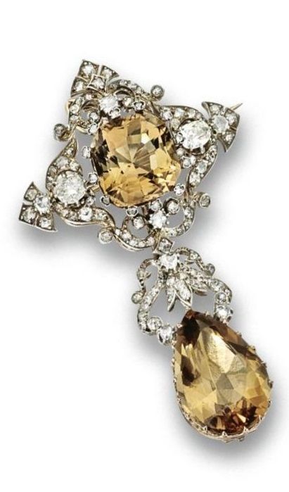 Topaz and diamond pendant-brooch, mid 19th Century. Set with a cushion-shaped to...