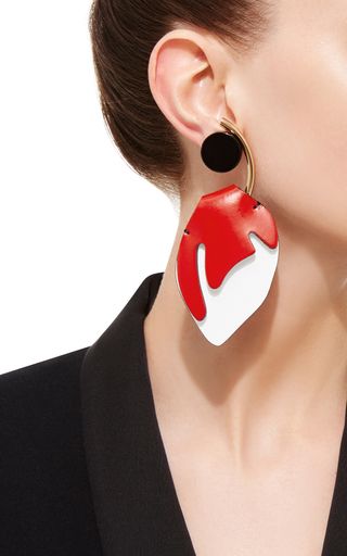 Bold, sculptural and modern, these **Marni** earrings feature an abstract red an...
