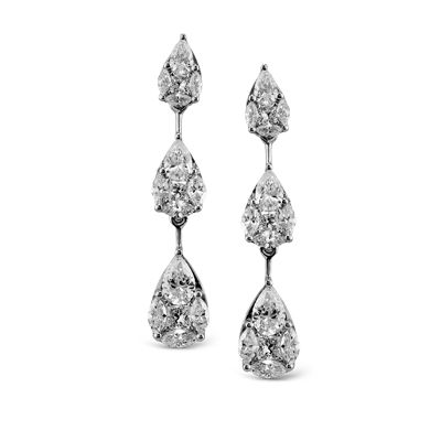 These striking 18K white earrings are comprised of .78ctw pear shape white Diamo...