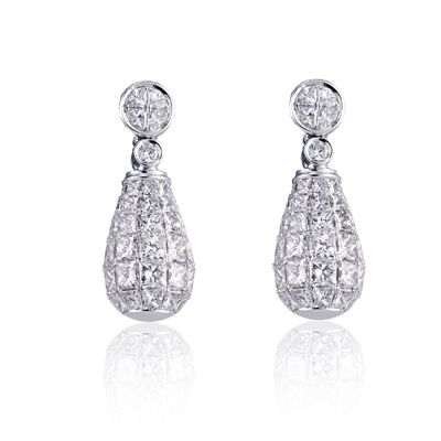 These stunning 18K white simon-set earrings are comprised of 3.09ctw princess cu...