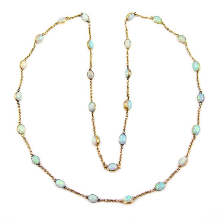 A 19th century double cabochon opal and gold chain necklace, circa 1900.
