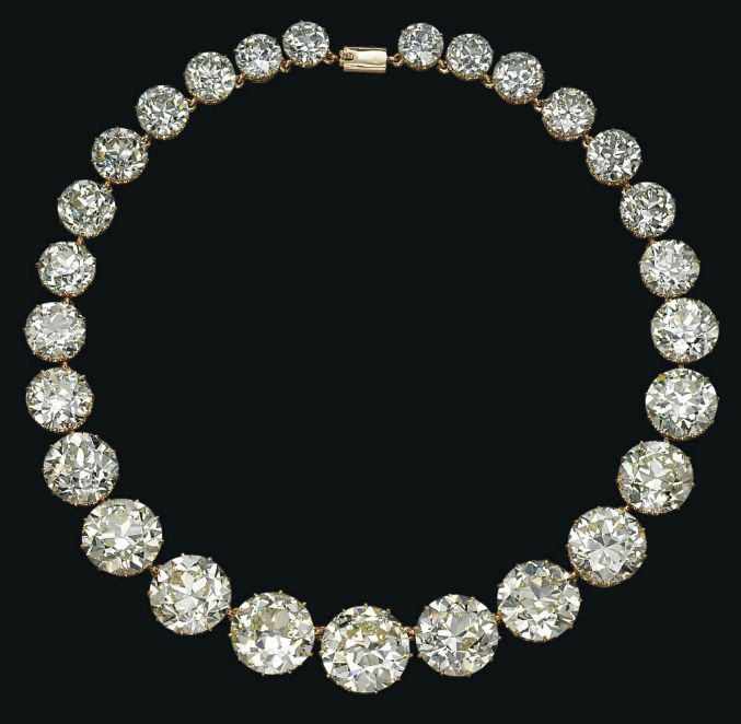 A Diamond Riviere Necklace - Set with twenty-seven graduated circular-cut diamon...