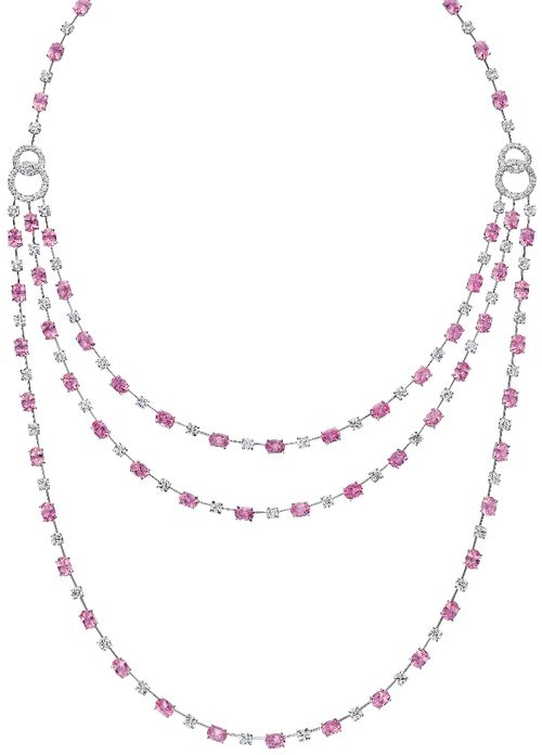 A Pink Sapphire and Diamond Necklace. The tapering front designed as three swagg...