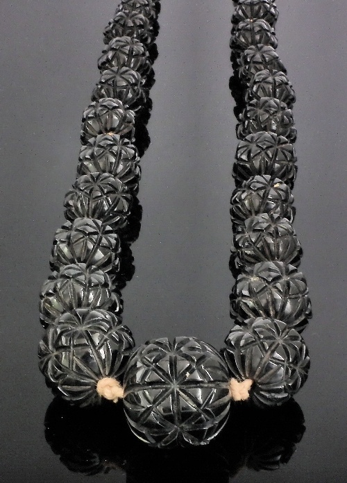 A Victorian strand of graduated carved jet & ebonised black wooden beads.