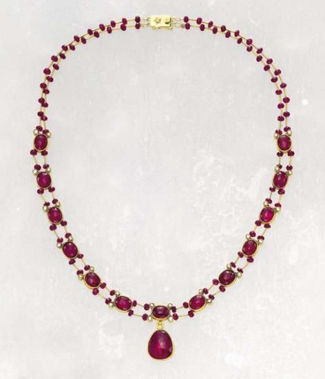 A diamond and ruby necklace designed as a series of thirteen rose-cut oval rubie...