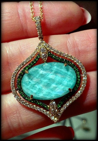 A fabulous pendant necklace with amazonite, diamonds, and tsavorite garnets. Fro...