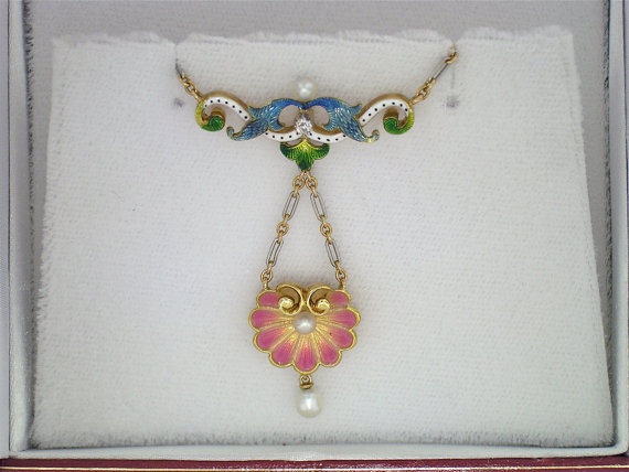 A rare diamond, pearl, enamel and gold pendant necklace, circa 1902-1910.