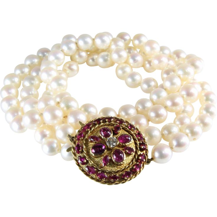 An exquisite Japanese cultured pearl, opera length necklace with a ruby, diamond...