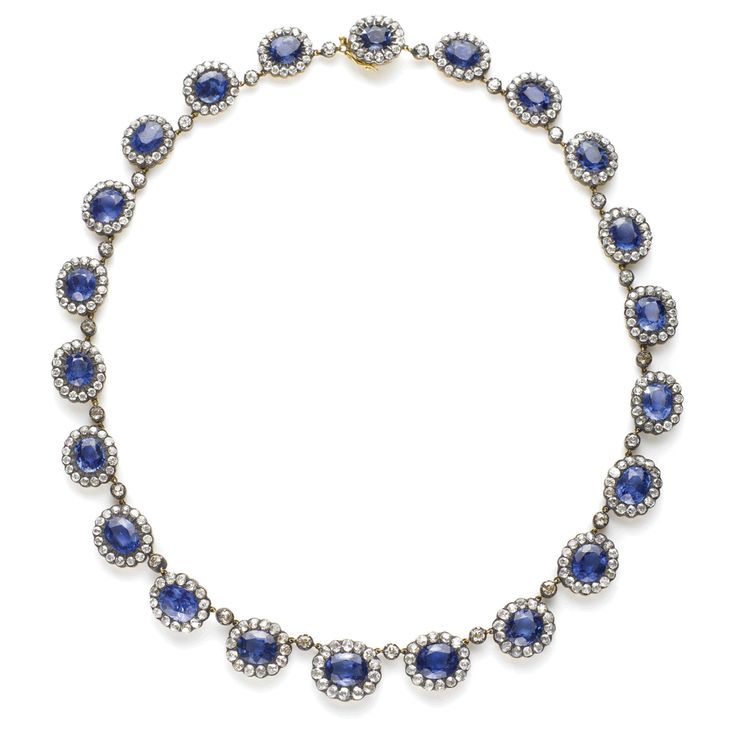 Antique Burmese sapphire and diamond cluster necklace set in gold and silver. En...