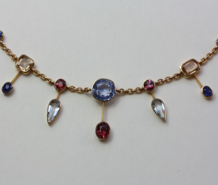 Aquamarine, sapphire, amethyst, tourmaline, garnet and gold necklace, England, c...