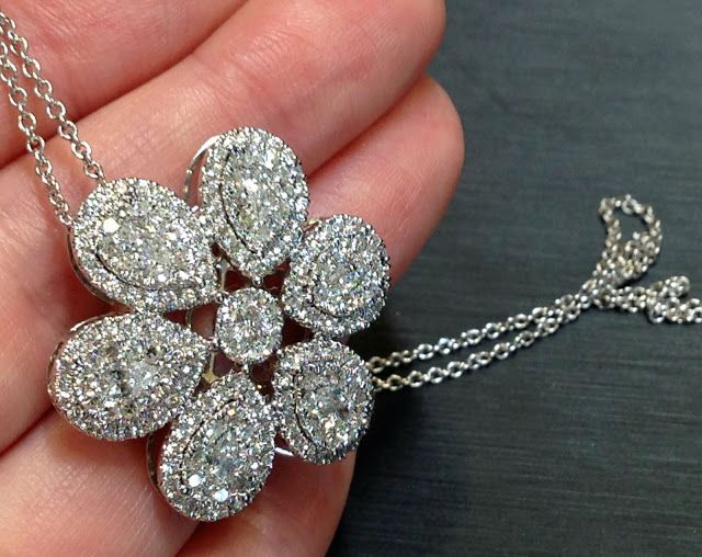 Floral diamond pendant necklace by Martin Flyer. Via Diamonds in the Library.