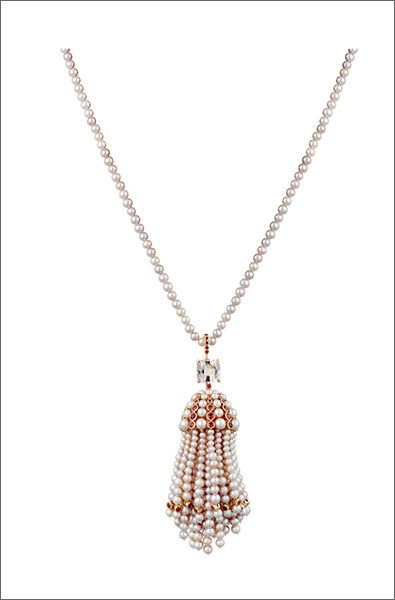 Ruby, pearl and gold tassel pendant on a pearl necklace, by Cartier.