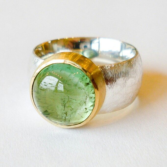 Silver and 22 karat gold ring with a stunning green tourmaline. www.heleenhoogen...