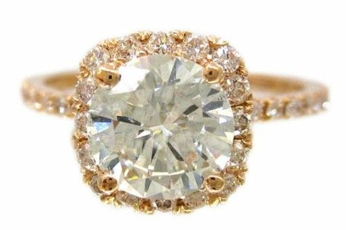 Gorgeous gold round cut square halo engagement ring.