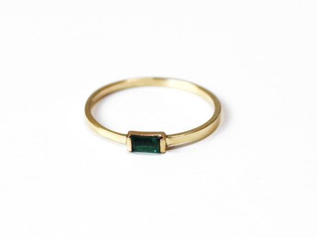 Swoon-worthy: a small slice of emerald set in a warm gold band.