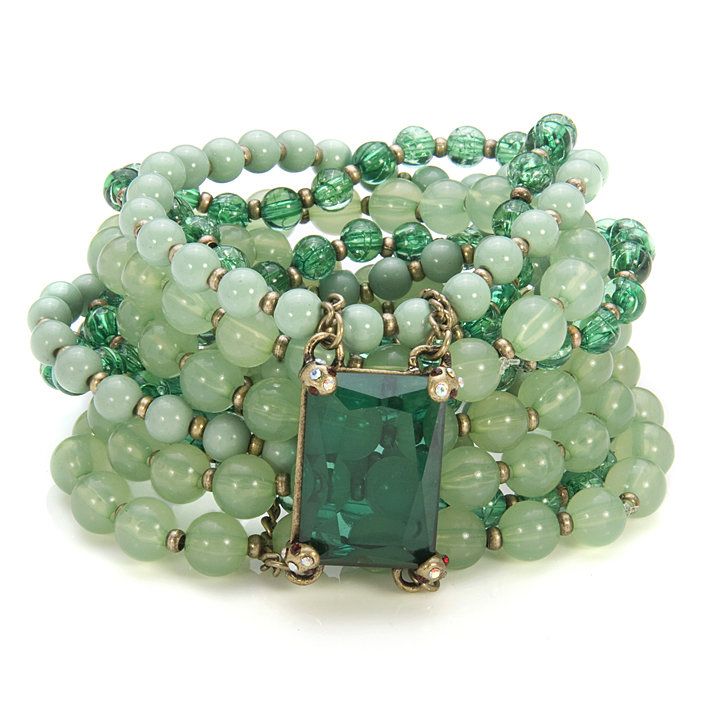 Seafoam green bracelet with beads and dark green gem.