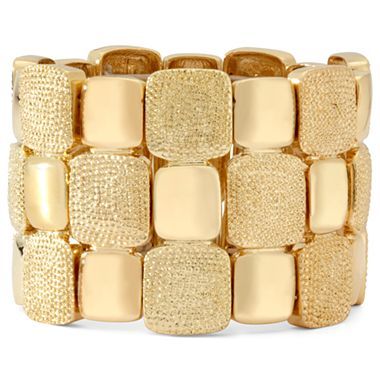 thick, multi-texture gold bracelet.
