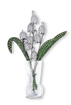 A DIAMOND AND TSAVORITE GARNET LILY OF THE VALLEY IN  CRYSTAL VASE BROOCH, BY MI...