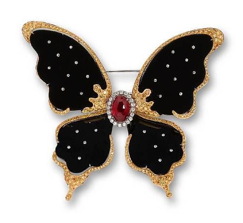 A black jadeite, ruby, and diamond butterfly brooch