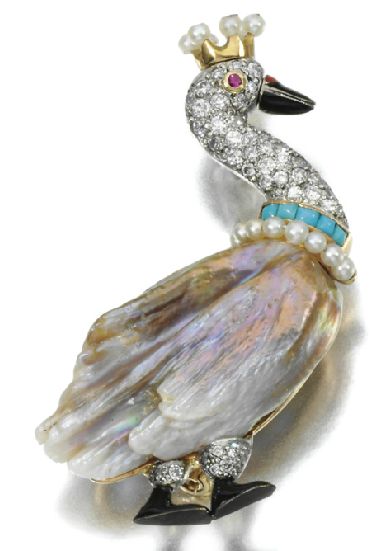 A diamond, ruby, turquoise, pearl, and mother of pearl brooch in the shape of a ...