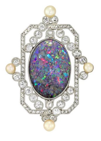 AN OPAL AND DIAMOND BROOCH  An opal and diamond brooch, the oval cabochon-cut bl...