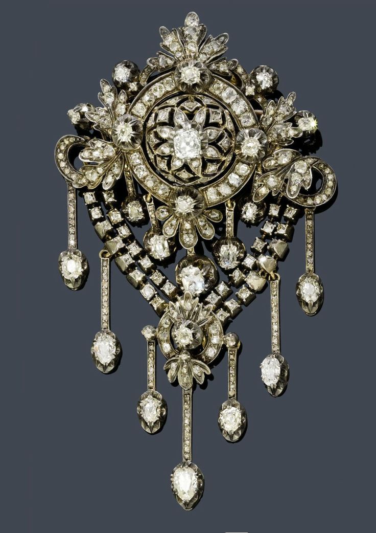 DIAMOND BROOCH, ca. 1880.   Silver over pink gold.   Fancy, florally open-worked...