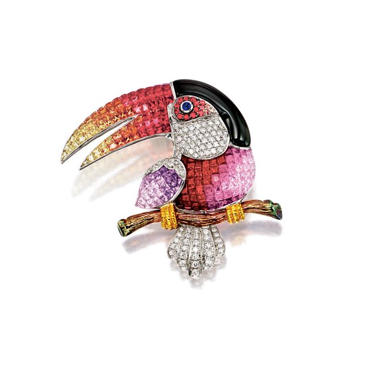 Modelled as a toucan perching on a branch, the body, beak and wings set with cal...