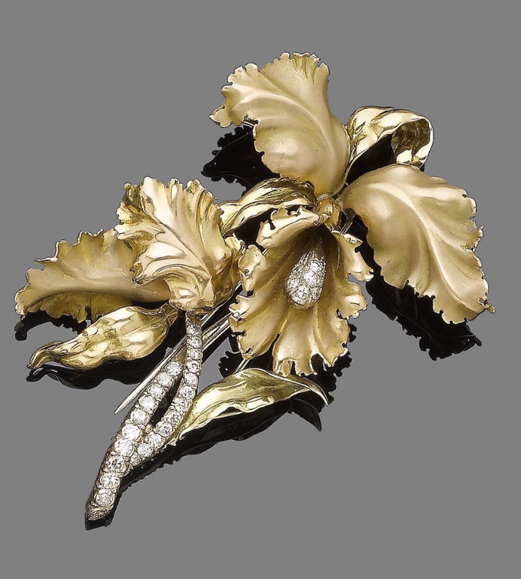 Stunning flower designed brooch, with the stem set with brilliant-cut diamonds!