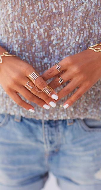 White nails + gold rings.