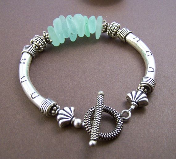 Genuine surf tumbled sea glass bracelet with sterling curved tubes. Stone Street...