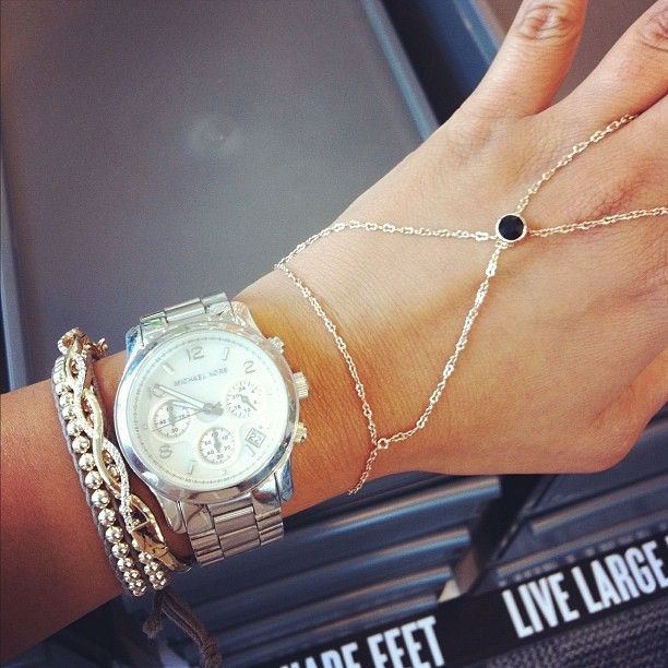 Michael Kors watches + hand chains.