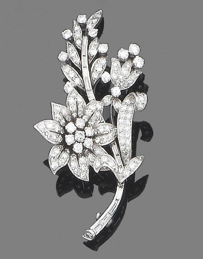 A diamond brooch  The floral spray, set throughout with brilliant and single-cut...