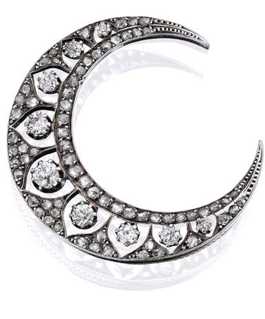 A diamond crescent brooch, French, circa 1900 Set with a graduated row of nine o...