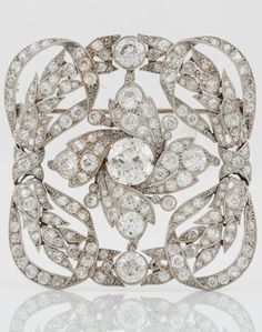 A large Belle Epoque platinum and old-cut diamond brooch, probably by Cartier. M...