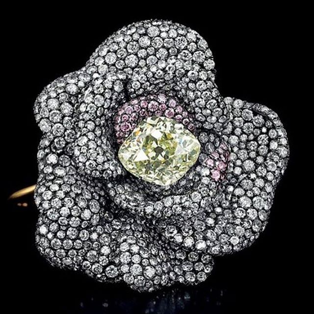 Designed as a Camellia flowerhead entirely pavé-set with diamonds and pink diam...