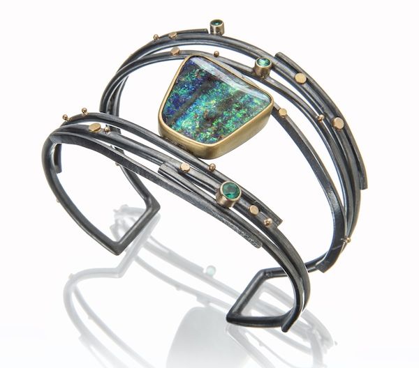 Twig cuff with Boulder opal and emeralds.  Oxidized silver, 18k and 22k gold. sy...