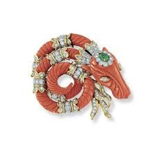 A coral, diamond and emerald brooch, by David Webb.