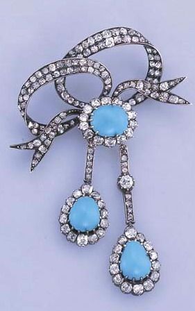 AN ANTIQUE TURQUOISE AND DIAMOND BROOCH