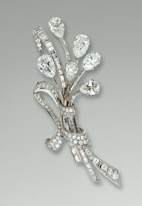 DIAMOND BROOCH, VAN CLEEF & ARPELS, 1950s.     Designed as a stylised ribbon tie...