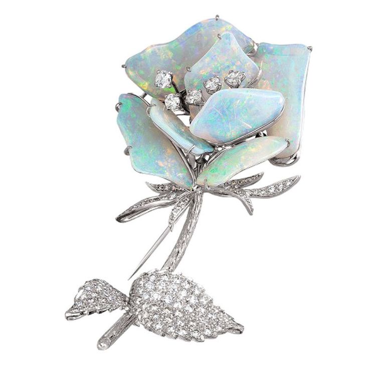 This vintage brooch is 18k white gold with diamonds and Australian opals.