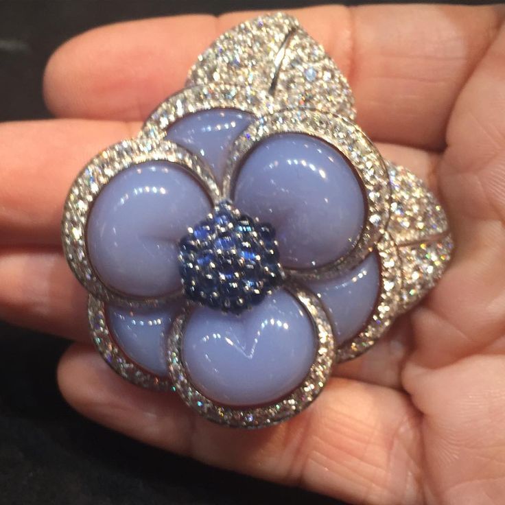 VAN CLEEF & ARPELS Chalcedony, Diamond, and Sapphire Flower Brooch………
