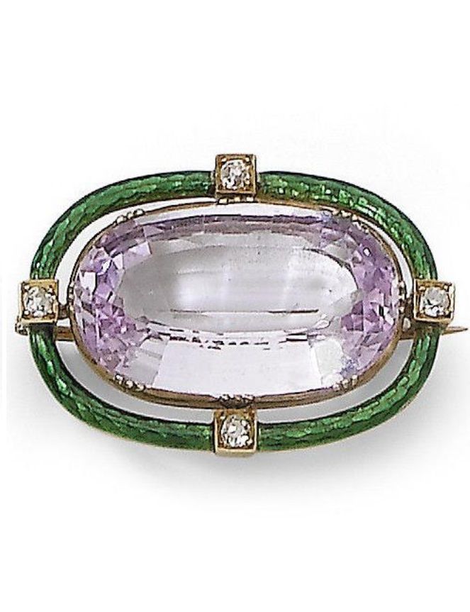 An early 20th century light violet/pink topaz and enamel brooch. The brooch in S...
